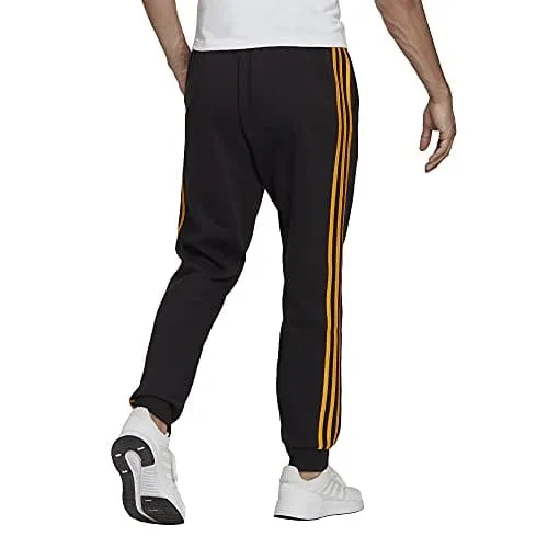 adidas Men's Essentials Fleece Tapered Cuff 3-Stripes Pants, Black/Semi Solar Gold, X-Small