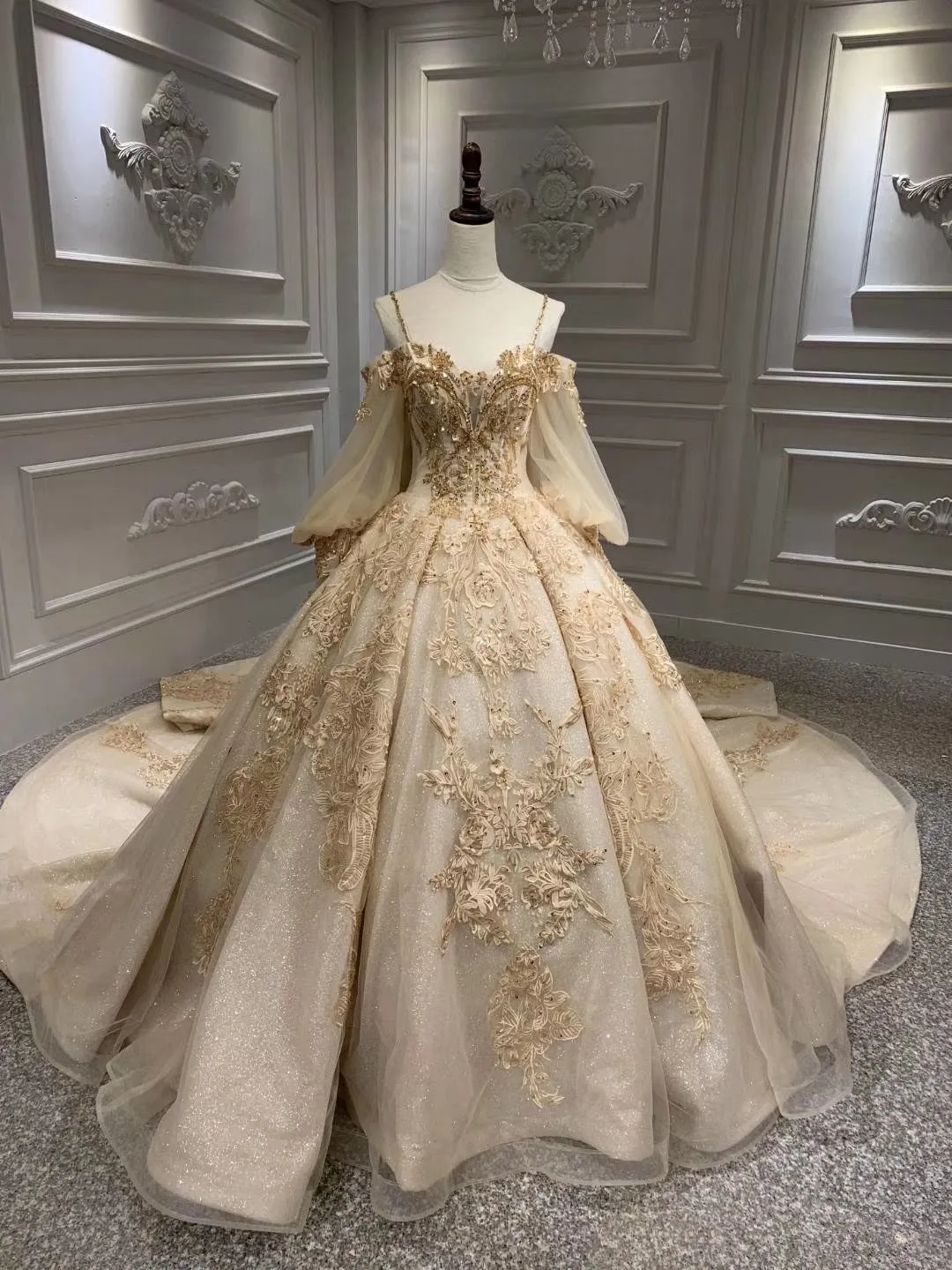 Unique off shoulder with puffy sleeves lace appliqués heavy beaded gold luxurious Long wedding gown